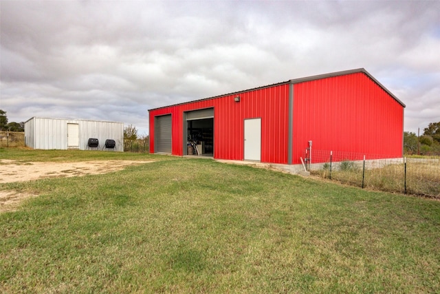 view of outbuilding with a lawn