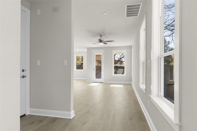 corridor featuring light hardwood / wood-style floors