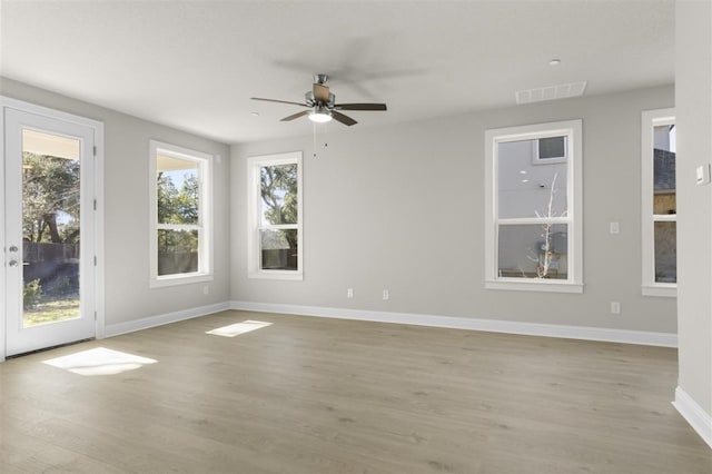 unfurnished room featuring ceiling fan and light hardwood / wood-style flooring