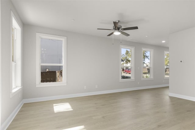 unfurnished room featuring light wood-type flooring and ceiling fan