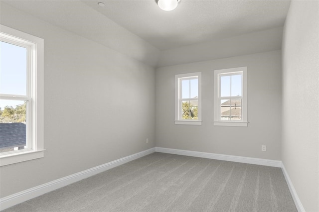 empty room featuring light colored carpet