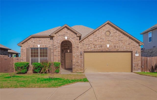 view of front of property with a garage