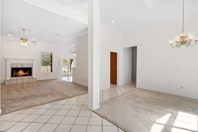 3600 Sawmill Dr, Austin, TX 78749 - unfurnished living room with light carpet, ceiling fan, light tile patterned floors, a fireplace, and crown molding