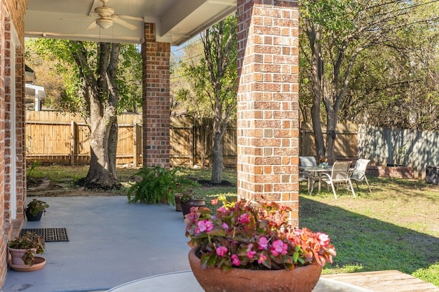 3600 Sawmill Dr, Austin, TX 78749 - fenced backyard featuring a ceiling fan and a patio area