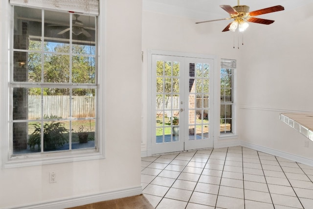 3600 Sawmill Dr, Austin, TX 78749 - unfurnished room featuring ceiling fan, plenty of natural light, and light tile patterned floors
