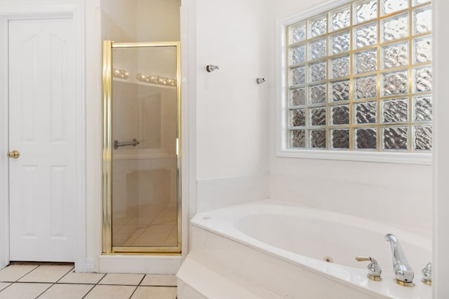 3600 Sawmill Dr, Austin, TX 78749 - full bathroom featuring a shower stall, a jetted tub, tile patterned floors, and plenty of natural light