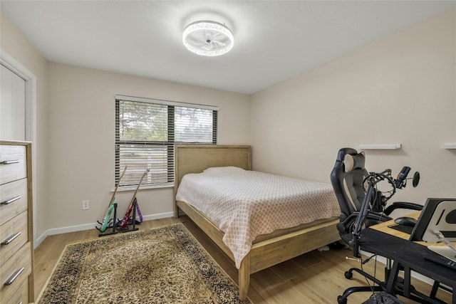 bedroom with light hardwood / wood-style floors