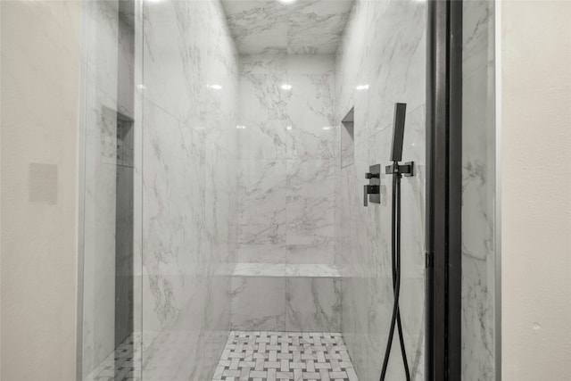 bathroom with tiled shower