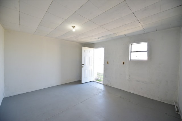 spare room with concrete floors