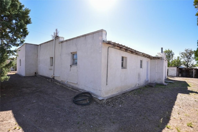 view of property exterior with stucco siding