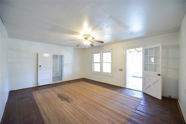 empty room featuring wood-type flooring and ceiling fan