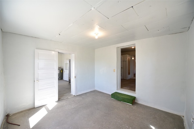 spare room featuring concrete flooring