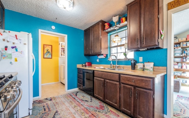 kitchen featuring dishwasher, a textured ceiling, high end range, and sink