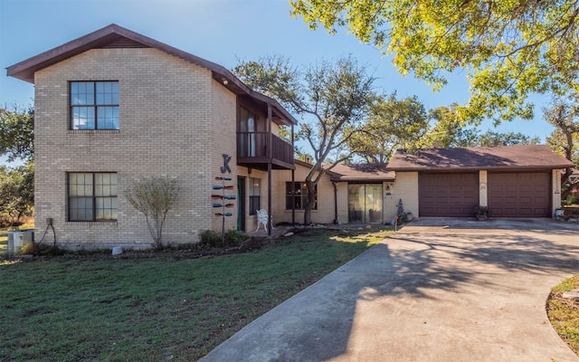 view of front of home featuring a balcony, a garage, a front lawn, and cooling unit