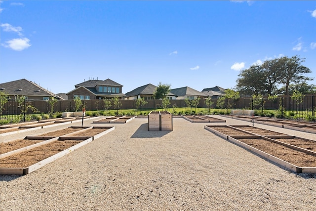 view of play area featuring a residential view and fence