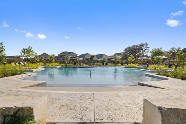 outdoor pool with a residential view