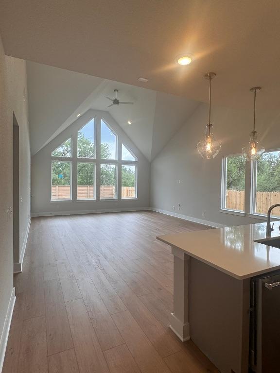 278 Smithsonian Ln, Kyle, TX 78640 - kitchen with healthy amount of natural light, ceiling fan, open floor plan, and vaulted ceiling