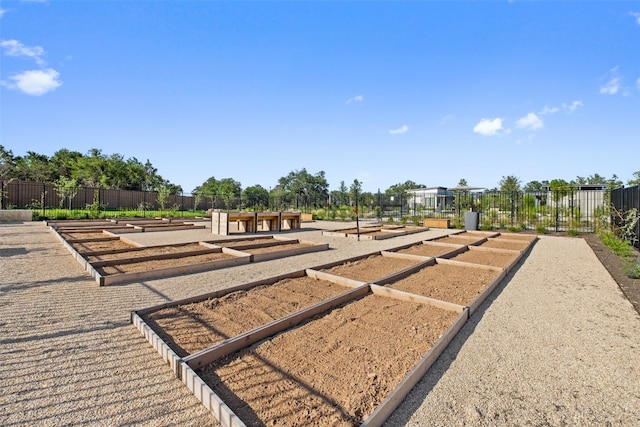 exterior space with a garden and fence