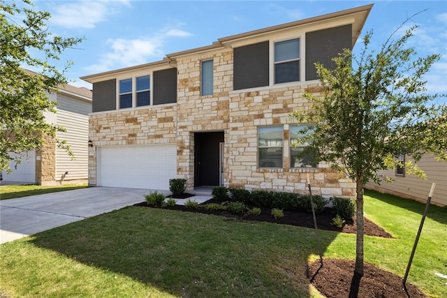 view of front of property with a front lawn and a garage