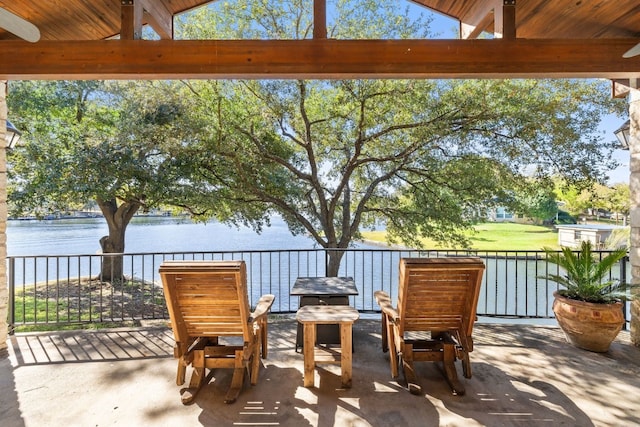 view of patio with a water view