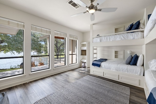 bedroom with ceiling fan and dark hardwood / wood-style flooring