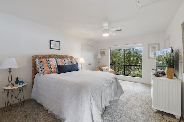 bedroom featuring light carpet, radiator heating unit, and ceiling fan