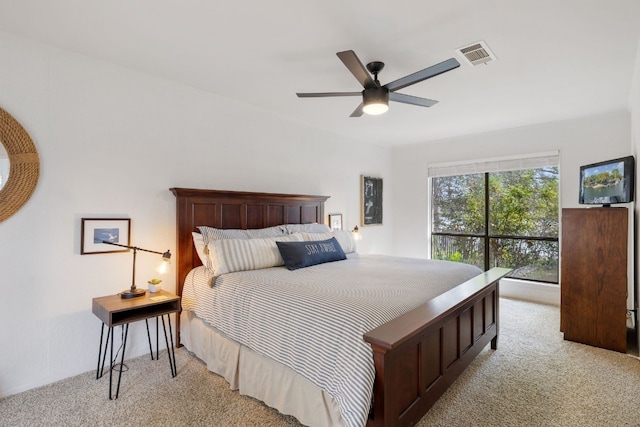 carpeted bedroom featuring ceiling fan