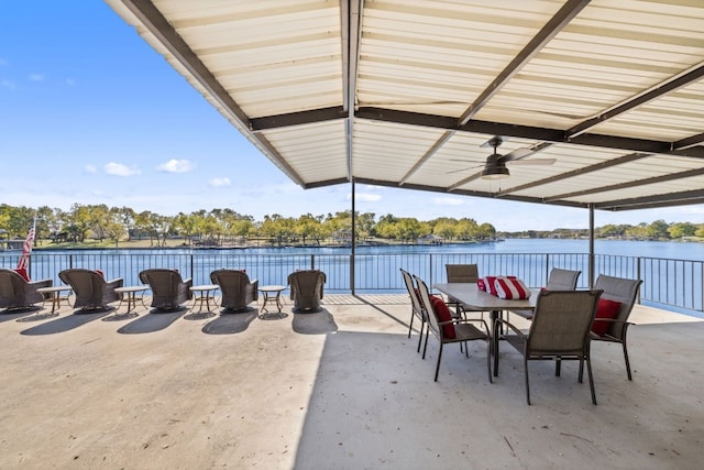 view of patio featuring a water view and ceiling fan