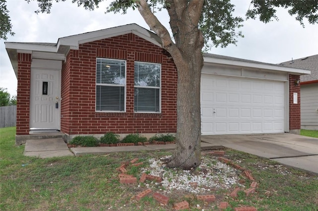 12817 Paloma Blanca Way, Del Valle, TX 78617 - view of front of home with an attached garage, concrete driveway, and brick siding