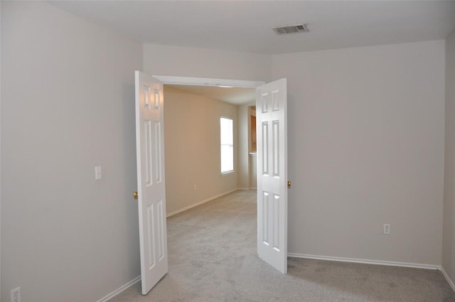 12817 Paloma Blanca Way, Del Valle, TX 78617 - empty room featuring light colored carpet and baseboards
