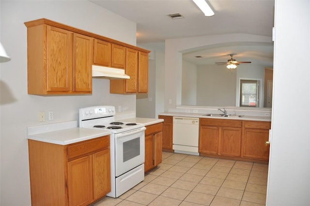 12817 Paloma Blanca Way, Del Valle, TX 78617 - kitchen with white appliances, under cabinet range hood, light tile patterned floors, ceiling fan, and light countertops