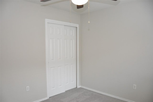 12817 Paloma Blanca Way, Del Valle, TX 78617 - unfurnished bedroom with carpet flooring, a closet, and a ceiling fan
