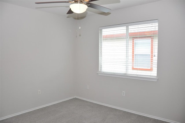 12817 Paloma Blanca Way, Del Valle, TX 78617 - empty room with ceiling fan, carpet floors, and healthy amount of natural light