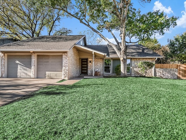 ranch-style home featuring a front yard and a garage