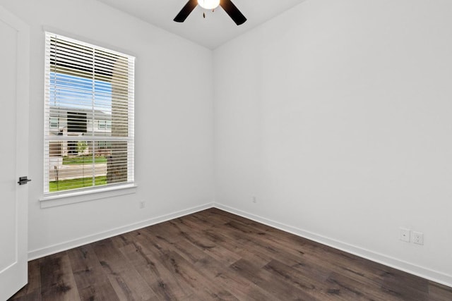 2109 Tobiano Trce, Georgetown, TX 78633 - spare room with a ceiling fan, dark wood-style floors, and baseboards