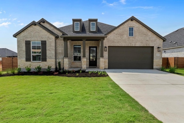 2109 Tobiano Trce, Georgetown, TX 78633 - view of front of home featuring concrete driveway, brick siding, covered porch, and a shingled roof