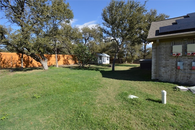 view of yard featuring a storage unit