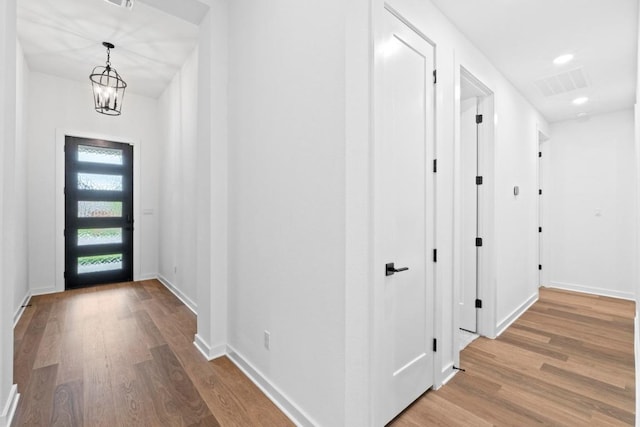 2113 Tobiano Trce, Georgetown, TX 78633 - foyer featuring light wood-style flooring, a chandelier, and recessed lighting