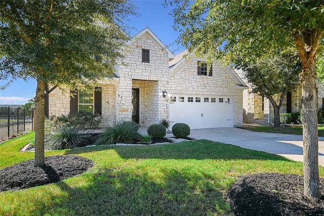 view of front facade featuring a garage and a front yard