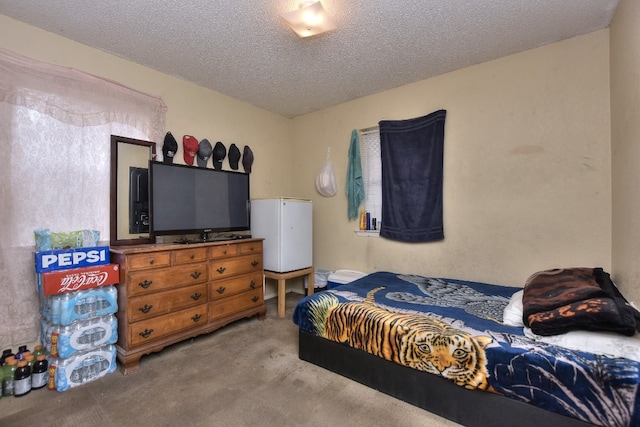 carpeted bedroom with a textured ceiling