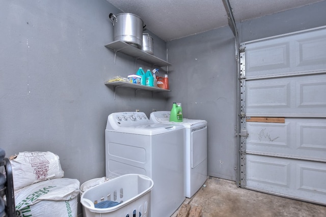 laundry area featuring separate washer and dryer and a textured ceiling