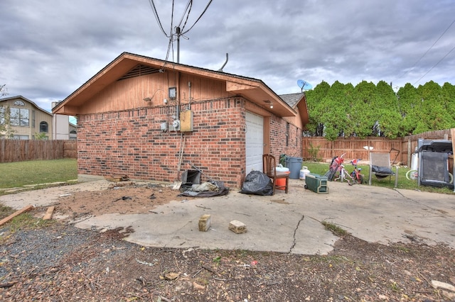 back of property with a garage