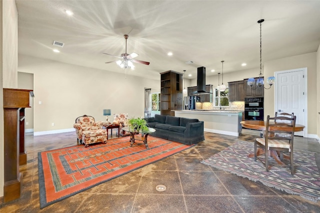 living room with visible vents, a ceiling fan, granite finish floor, recessed lighting, and baseboards