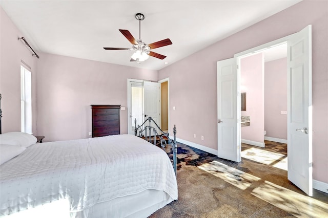 bedroom with baseboards, carpet floors, and ceiling fan