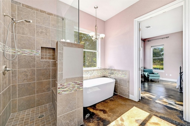 full bath with visible vents, walk in shower, concrete flooring, a freestanding tub, and a notable chandelier