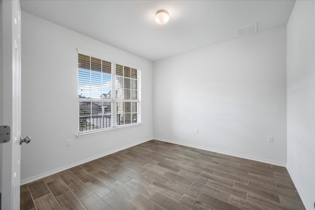 spare room featuring hardwood / wood-style flooring