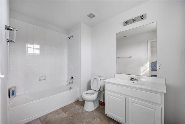 full bathroom with tiled shower / bath combo, toilet, and vanity