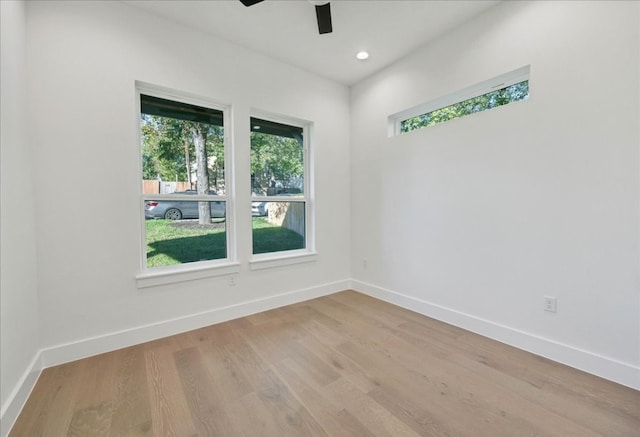 unfurnished room featuring ceiling fan and light wood-type flooring