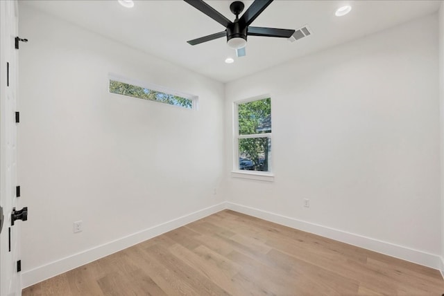 spare room featuring ceiling fan and light hardwood / wood-style flooring