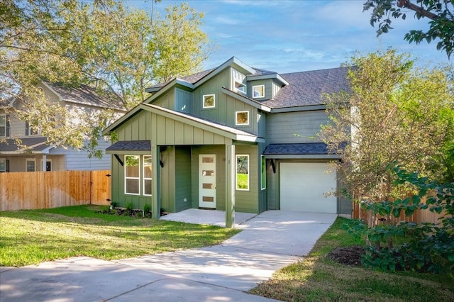 view of front facade featuring a garage and a front yard